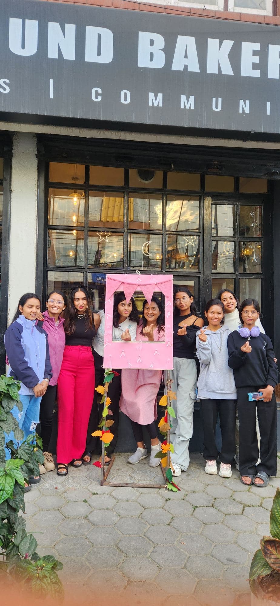 Outside the Higher Ground bakery after an awareness event