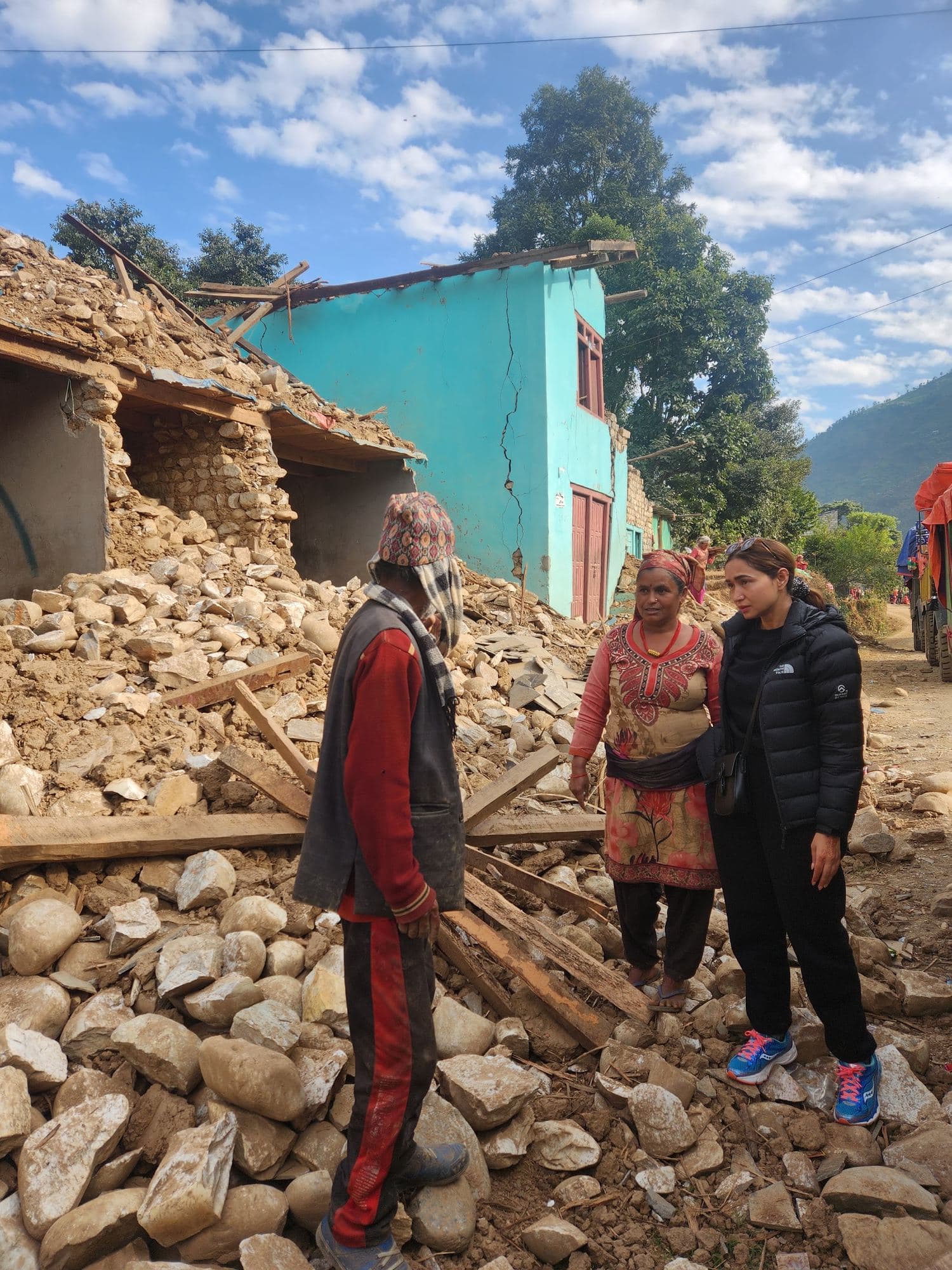 Walking through the rubble of homes destroyed by the earthquake