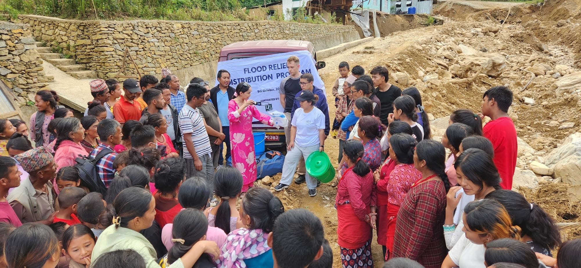 Speaking to residents beside the flood relief van in Kavrepalanchok, October 2024