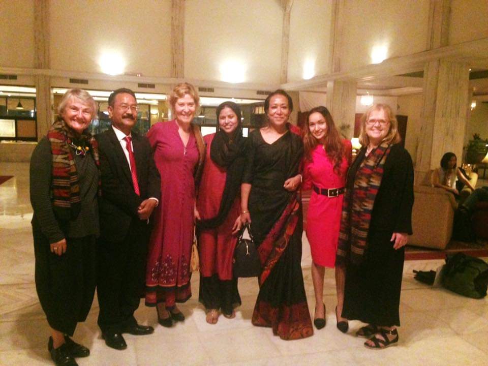 Pooja with visiting trainers and partners at an evening gathering in Kathmandu