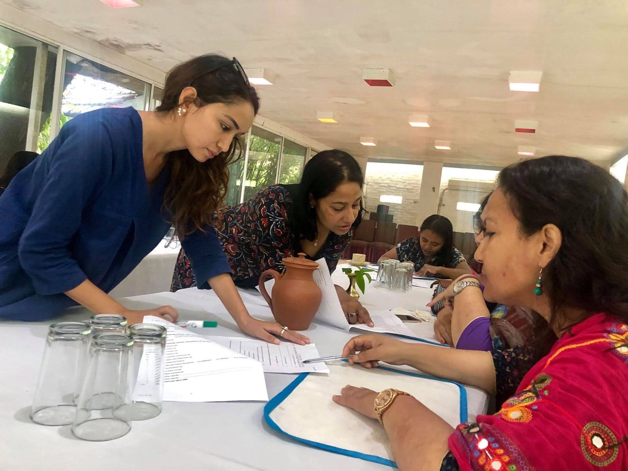 Lawyers working through papers together at a training table
