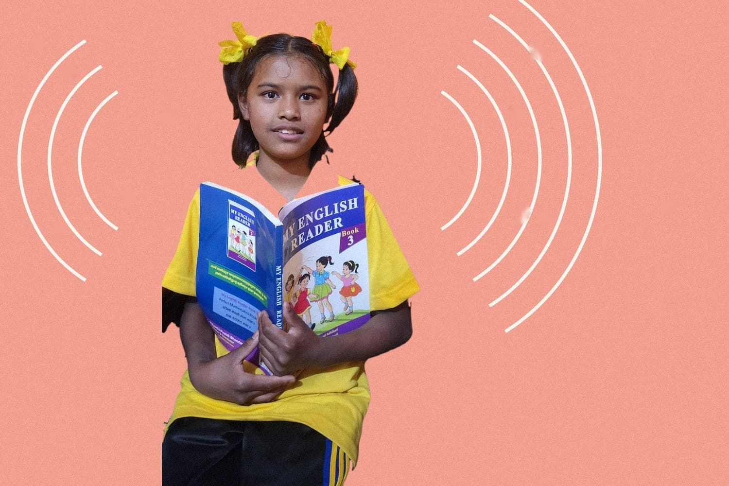 Roshmi holding her English reader