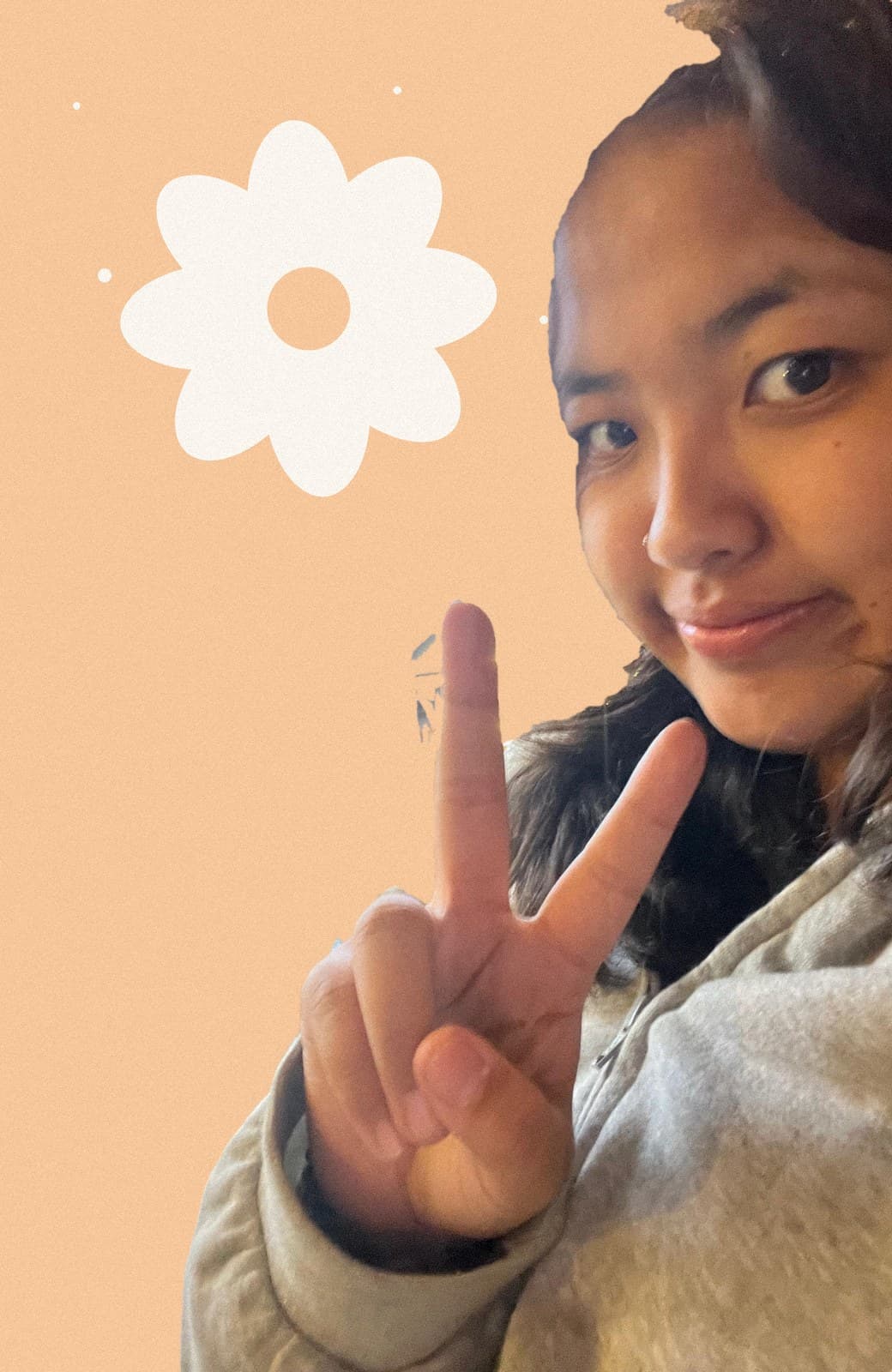 Purnima making a peace sign at the camera